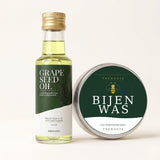 TheWootz flesje druivenpitolie en blikje bijenwas, van bovenaf.